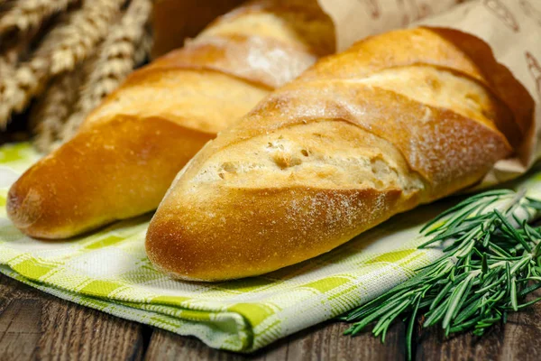 French Bread Baguette.The fresh baked rustic bread loaves in pap