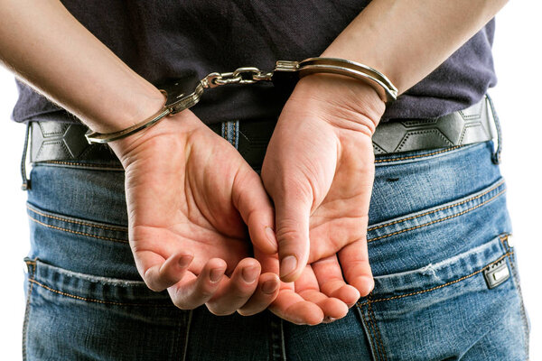 Adult male arrested and handcuffed.Man under Arrest. Hands with 