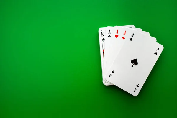 Playing cards on green table in cacino,poker — Stock Photo, Image