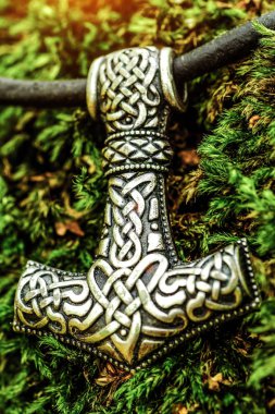 Scandinavian amulet in the form of the Thor's hammer  clipart