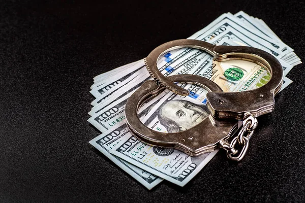 Police handcuffs. Financial crime, dirty money and corruption co — Stock Photo, Image