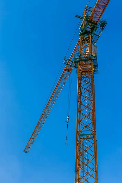 Construction site background. Hoisting cranes and new multi-stor