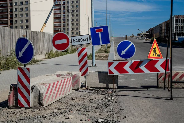 Work in progress. Roadworks, road signs. Men at work. Some signs