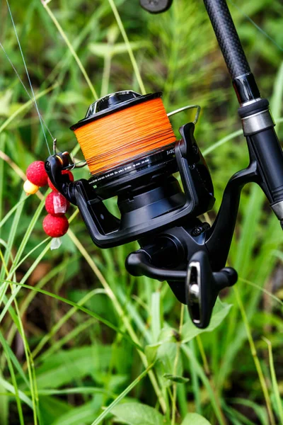 Carp spinning reel angling rods on pod standing. Carp Rods,Carpfishing session at the Lake.Professional fishing equipment