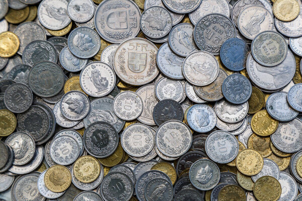 Coins of Switzerland. Libertas head depicted in the Swiss 10 rappen coin.Coins background.Coins from various countries from all over the world.