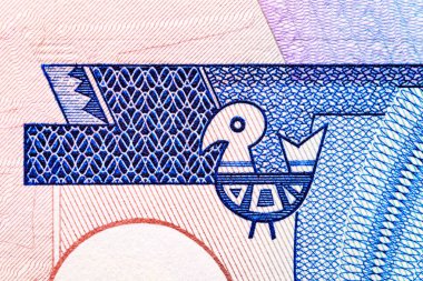 Solomon Adaları 5 dolar 2006.Ton balığı, arma; martı. Arka tarafta nehir kıyısında geleneksel bir ev var, bir teknenin yanında bir balıkçı. Bonistic. Tasarım amaçlı..