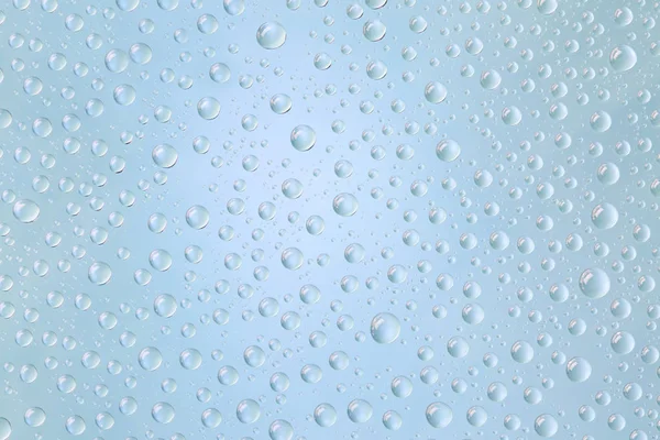 Buzlu cam üzerinde normal şekil güzel su damlacıkları 