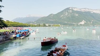 Annecy, France - 10 August 2025: Boats floating on Lake Annecy with French Alps mountains in summer scenic landscape travel destination France