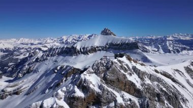 Panoramic Aerial View of Glacier 3000 with Alpine Peaks, Suspended Bridge (Peak Walk), Cable Car Lift, and Ski Resort at the Summit in Switzerland