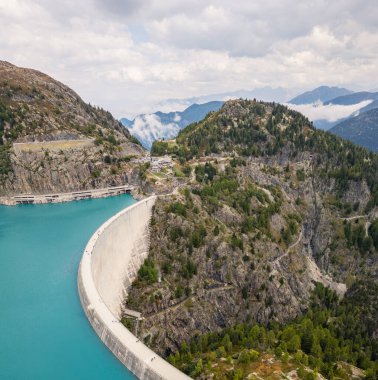 Aerial panoramic view of Emosson Dam and Lake in the Swiss Alps, renewable hydropower reservoir and mountain landscape, sustainable clean energy infrastructur
