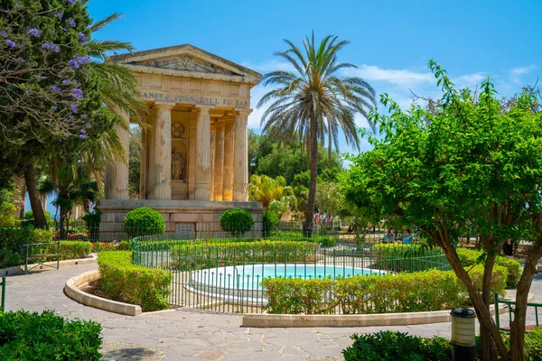 Amazing gardens and parks in the enter of the old town of Valletta with palms flowers and ancient acropolis
