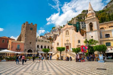 July 04, 2018. Taormina, Italy. Beautiful old town of Taormina with small streets, flowers, cafes and palms.  clipart