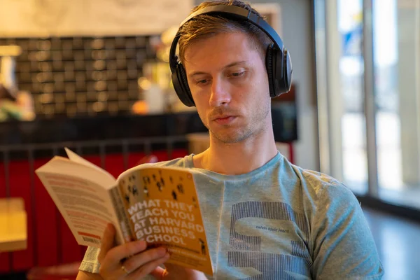 June 2018 Valletta Malta Young Man Sitting Cafe Earphones Reading — Stock Photo, Image