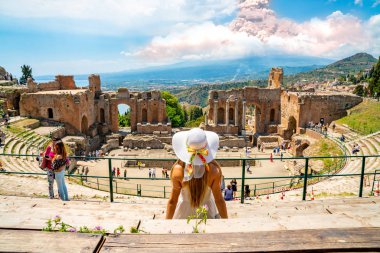 May 10, 2010. Taormina, Italy. Eruption of the Etna volcano. View from the Taormina old town theatre on the eruption.  clipart
