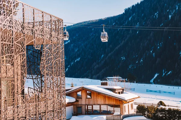 Saalbach, Austria. March 20, 2018. Beautiful view from the luxury balcony on the Alps, mountains and cable car over ski slopes in Austrian Alps. Luxury hotel modern design.