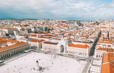 LISBON, PORTUGAL - 08/20/2018 - Aerial view of the famous Praca do Comercio (Commerce Square) - one of the main landmarks in Lisbon. Beautiful Portuguese architecture. clipart