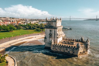 Aerial drone panorama photo of the Belem Tower. A medieval castle fortification on the Tagus river of Lisbon, Portugal. clipart