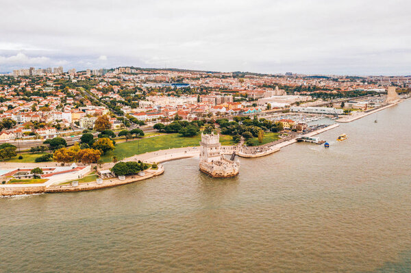 Aerial view of the Tagus river near Belem tower in Lisbon, Portugal.