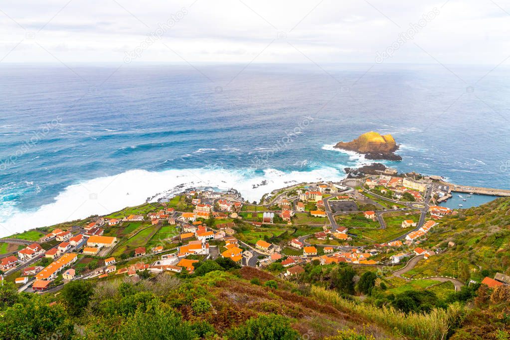View of the village of Porto Moniz with lava-rock pool, Madeira Island, Portugal.