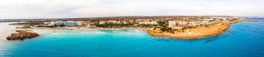 Nissi beach in Ayia Napa, clean aerial photo of famous tourist beach in Cyprus. The best resort area of Cyprus, Nissi beach, the hotels, gulfs, parks. clipart