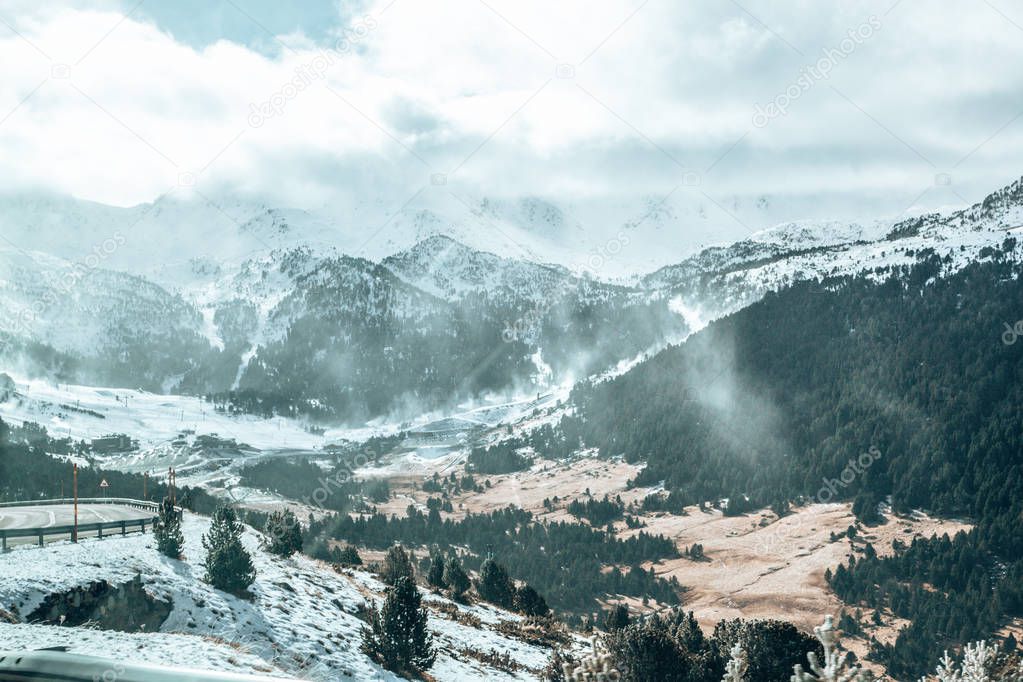 Ski slopes in Andorra with people skiing in the mountains.