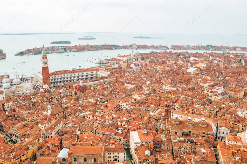 Beautiful Venice view from above. Orange roofs and classical architecture. 