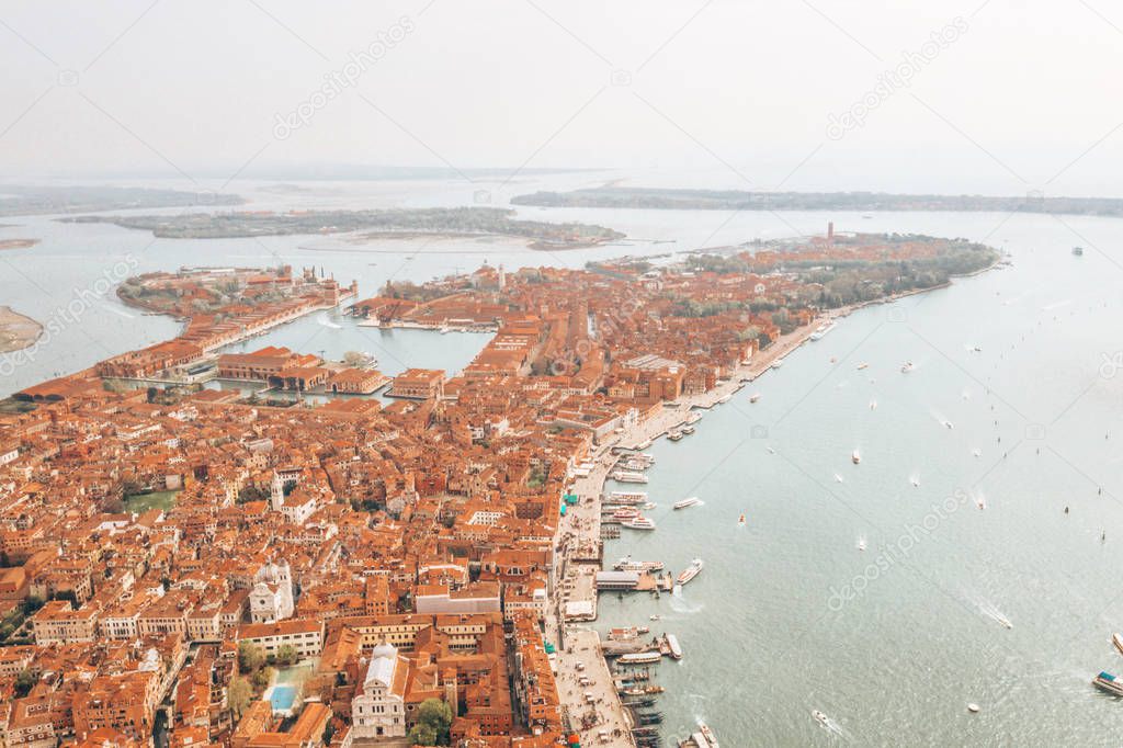 Beautiful Venice view from above. Orange roofs and classical architecture. 
