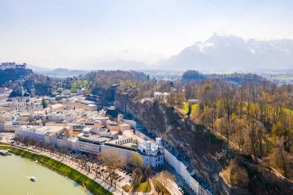 Beautiful aerial Salzburg city view. Austrian traditional style with mighty Alps in the background.