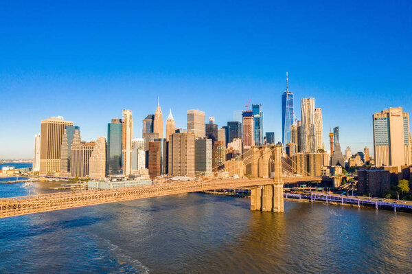 Famous Skyline of downtown New York, Brooklin Bridge at the early morning sun light , New York City, USA