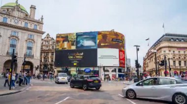 LONDON, UK. 2019, JUNE 20: Daytime timelapse shot of Piccadilly Circus in London, England, UK, including the Piccadilly Lights, also known as The Curve