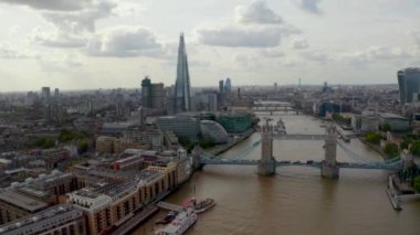 Aerial view of the Tower Bridge, city of London and the Shard skyscraper.  