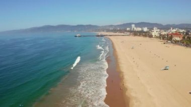 Aerial view of the Santa Monica Pier, in Santa Monica, LA, California. Beautiful view of the pier with amusement park and people around it.