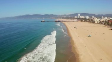 Aerial view of the Santa Monica Pier, in Santa Monica, LA, California. Beautiful view of the pier with amusement park and people around it.