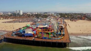 Aerial view of the Santa Monica Pier, in Santa Monica, LA, California. Beautiful view of the pier with amusement park and people around it.