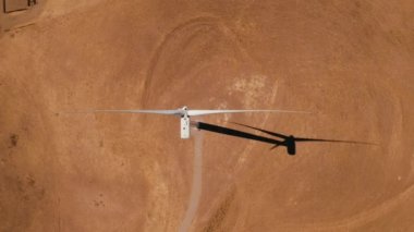 Aerial view of the wind power stations in Arizona, USA. Wind power is the use of air flow through wind turbines to mechanically power generators for electric power.