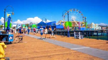 Aerial view of the Santa Monica Pier, in Santa Monica, LA, California. Beautiful view of the pier with amusement park and people around it.
