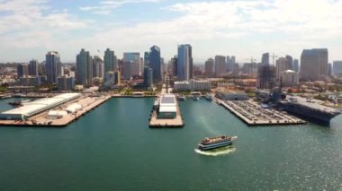 Aerial view of the San Diego harbour near the Downtown, CA. Flying near the docks and USS Midway carrier.