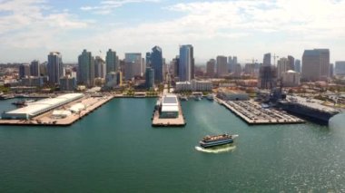 Aerial view of the San Diego harbour near the Downtown, CA. Flying near the docks and USS Midway carrier.