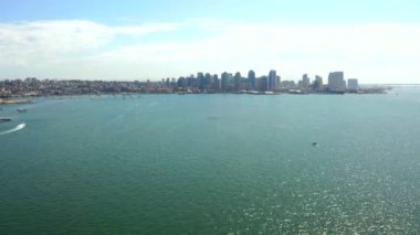 Aerial view of the San Diego harbour near the Downtown, CA. Flying near the docks and USS Midway carrier.