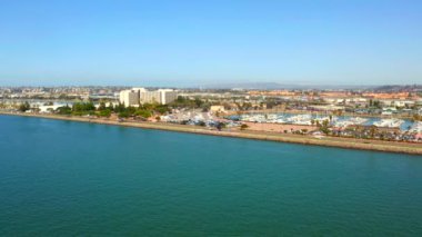 Aerial view of the San Diego harbour near the Downtown, CA. Flying near the docks and USS Midway carrier.