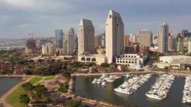 Aerial view of the San Diego harbour near the Downtown, CA. Flying near the docks and USS Midway carrier.