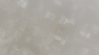 Rising and flying over the clouds during morning sunrise in San Francisco with skyscrapers rising above the clouds. Beautiful California, San Francisco.