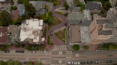 Aerial panoramic view of Lombard Street, an eastwest street in San Francisco, CA. Famous for steep, one-block section with eight hairpin turns. Crookedest, steep hills, sharp curves, one-way road.