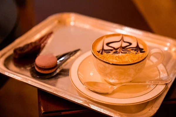 Cup of Golden Cappuccino in Abu Dhabi. Coffee with gold decoration. UAE. United Arab Emirates.