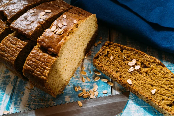 homemade corn bread on a blue wooden table