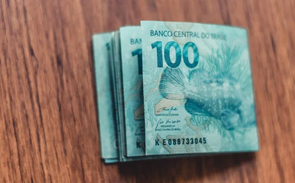 Money from Brazil. Notes of Real, and coins, Brazilian currency, Brazil BRL. Concept of savings, salary, payment and funds.