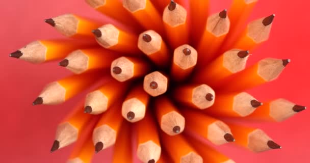 Yellow coated pencils rotating in slow motion. Close up top view, shot on RED 6K camera — 비디오