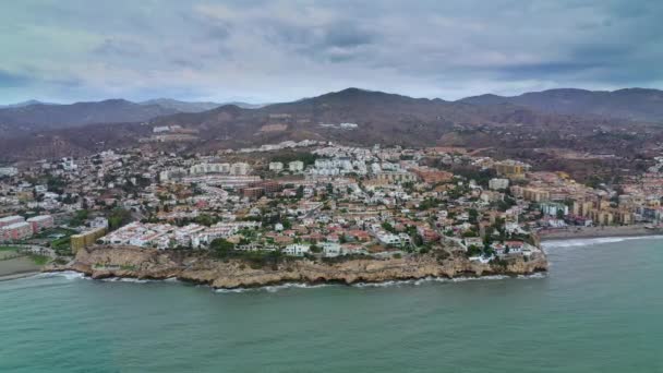 Aerial view of Cala del Moral coastline with the sea and mountains surrounding it. Malaga, Spain. Summer, 2019 — Stock Video