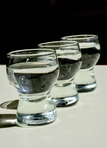 Vodka glasses covered with frost after cooling