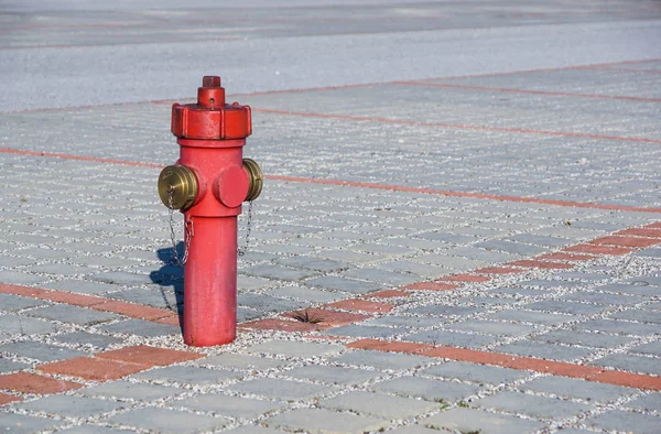 Old red fire hydrant in the street. Fire hidrant for emergency fire access